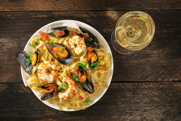 Seafood pasta with mussels, shrimps, and white wine