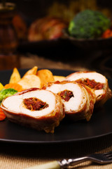 Delicious chicken rolls with dried tomatoes and mozzarella.