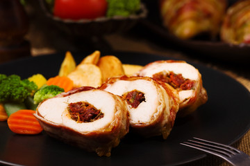 Delicious chicken rolls with dried tomatoes and mozzarella.