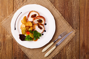 Delicious chicken rolls with dried tomatoes and mozzarella.