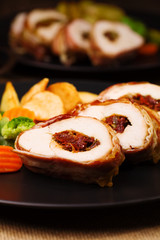 Delicious chicken rolls with dried tomatoes and mozzarella.