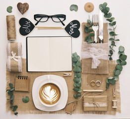 Wedding planner flat lay composition. Notebook with accessories and wedding decorations. Workspace,...