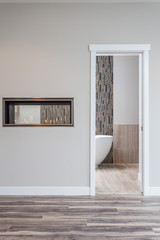 Modern Bathroom With See Through In-wall Fireplace