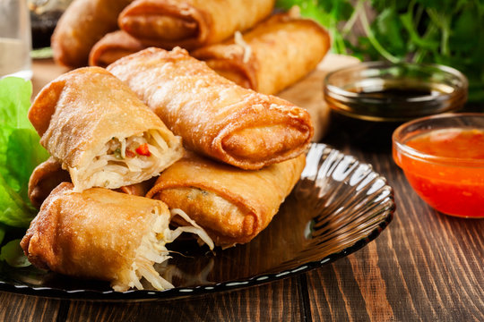 Spring rolls with chicken and vegetables served with sweet chili sauce or soy sauce