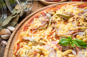 delicious italia pizza in a restaurant, on the wooden desk