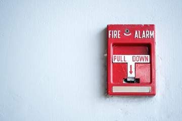 The red fire alarm.