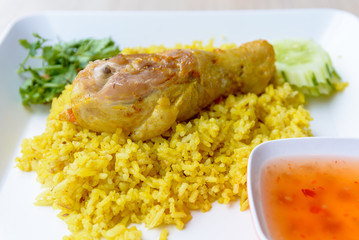 Chicken Biryani with green chutney, islamic food.