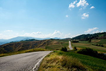 Winding blacktop road through the hills, Monte Altavelio, Italy
