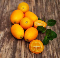 Kumquats on a wooden table