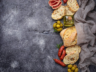 Italian ciabatta bread with olives and salami.