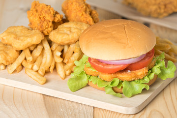 Fast food hamburger with set fried chicken and french fries.