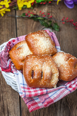 Buns with berries on a wooden table.
