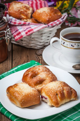 Buns with berries on a wooden table.
