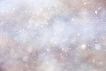 Snowfall texture of snowflakes on blurred background
