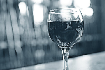 Serving a glass of red wine in a restaurant