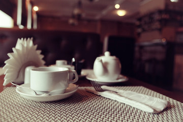 teapot and cup of tea at a cafe