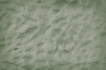 Fototapeta na wymiar Background of green vintage rough adobe