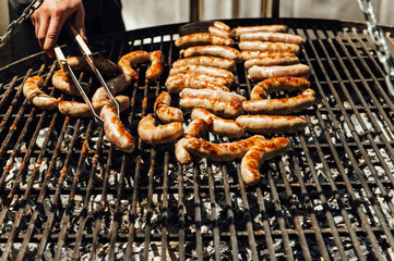 Assorted meat and vegetables grilling over fire