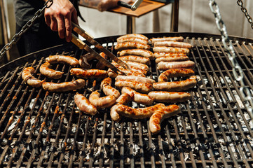 Assorted meat and vegetables grilling over fire