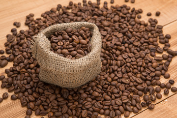 Coffee beans on the boards cup rustic style spices burlap grain scattered