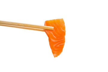 Salmon slice sashimi in chopsticks isolated on white background