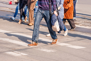 people crossing the pedestrian crossing