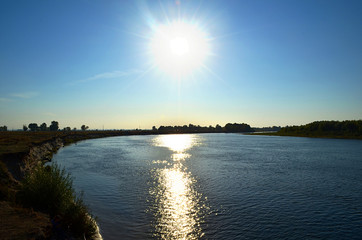 White sun over the river
