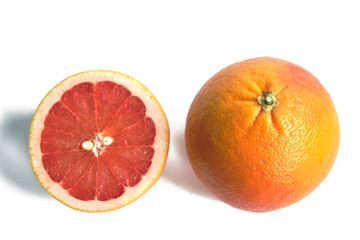 Closeup of red grapefruits on a white background