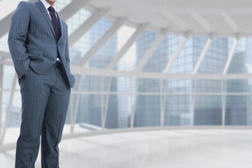 Fototapeta premium Part of businessman standing on in empty building