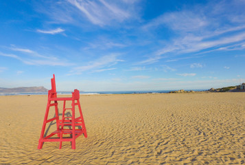 Red Lifesavers Chair on the Beach