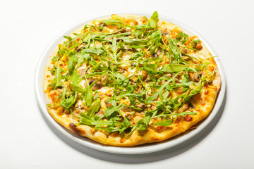 Pizza with mushroom and arugula on a white background