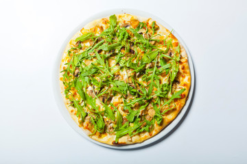 Pizza with mushroom and arugula on a white background