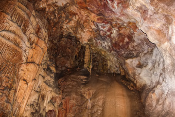 Underground cave with stalactites and stalagmites.