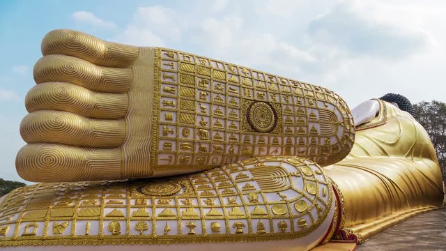 Foot print of Buddha statue in Buddhist temple. Time Lapse.