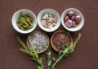 Chili, garlic, red onion and rice in circular.