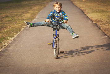 little boy doing tricks riding bike
