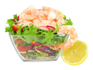 Simple fresh prawn salad in a glass dish isolated on a white background