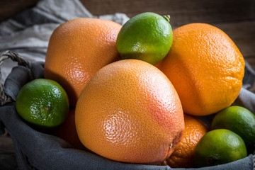 Fresh juicy citrus fruits in a basket.