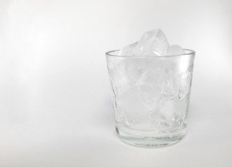 Ice cubes in glass isolated on white