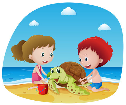 Children and sea turtle on the beach