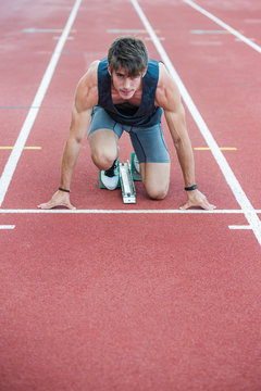 Determined sportsman on crouch start