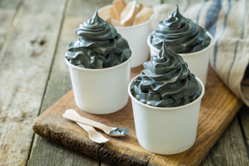 Black ice cream in white cups