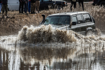 Jeep speeding through the water © Aldas