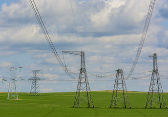 High-voltage power line against the sky and clouds 