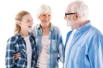 happy grandfather, grandmother and granddaughter together isolated on white