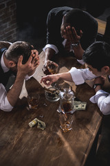 colleagues drinking alcohol while spending time together after work