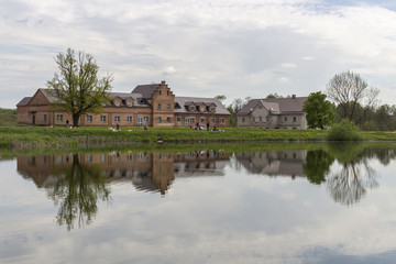 Fototapeta na wymiar Old buildings are displayed in a pond in Minsk