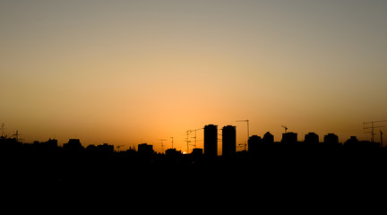 Silhouette of the skyline of town at sunset - Petach Tikva, Israel