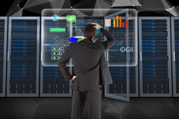 Businessman is analyzing data against database background