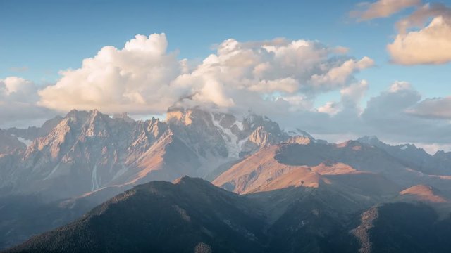 Mystical nature in ancient mountains of Europe. 4K Timelapse of amazing sunset at the Ushba mountain. Svaneti. Georgia. Europe. UHD video (Ultra High Definition). Virgin nature where no man feet was.